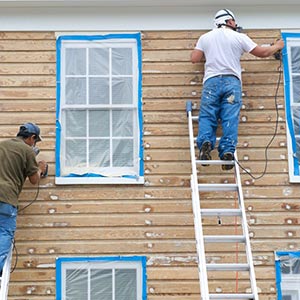 Peinture d'une facade exterieure en bois